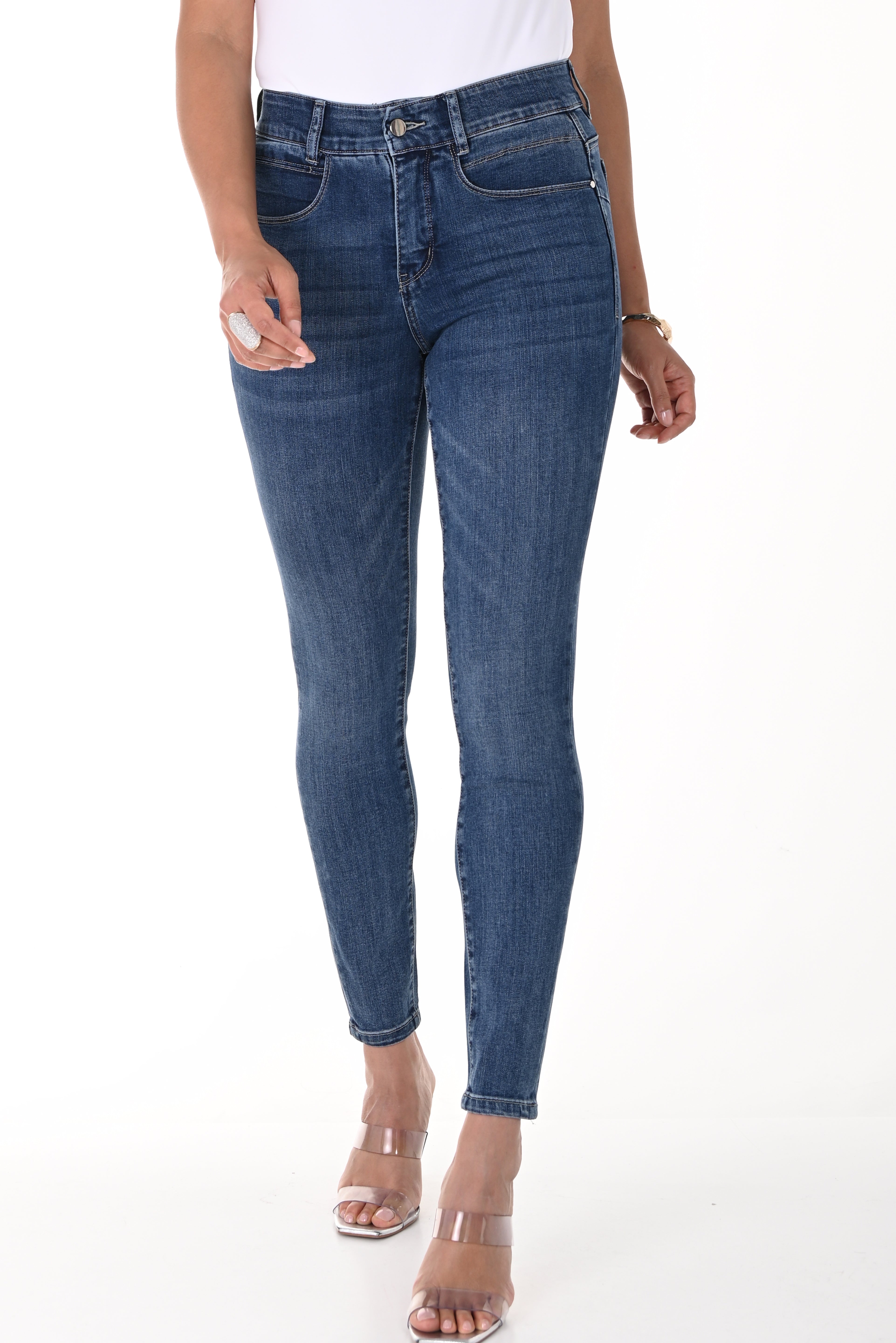 Model wearing high-rise comfort stretch slim jeans, showcasing a polished and comfortable denim look.