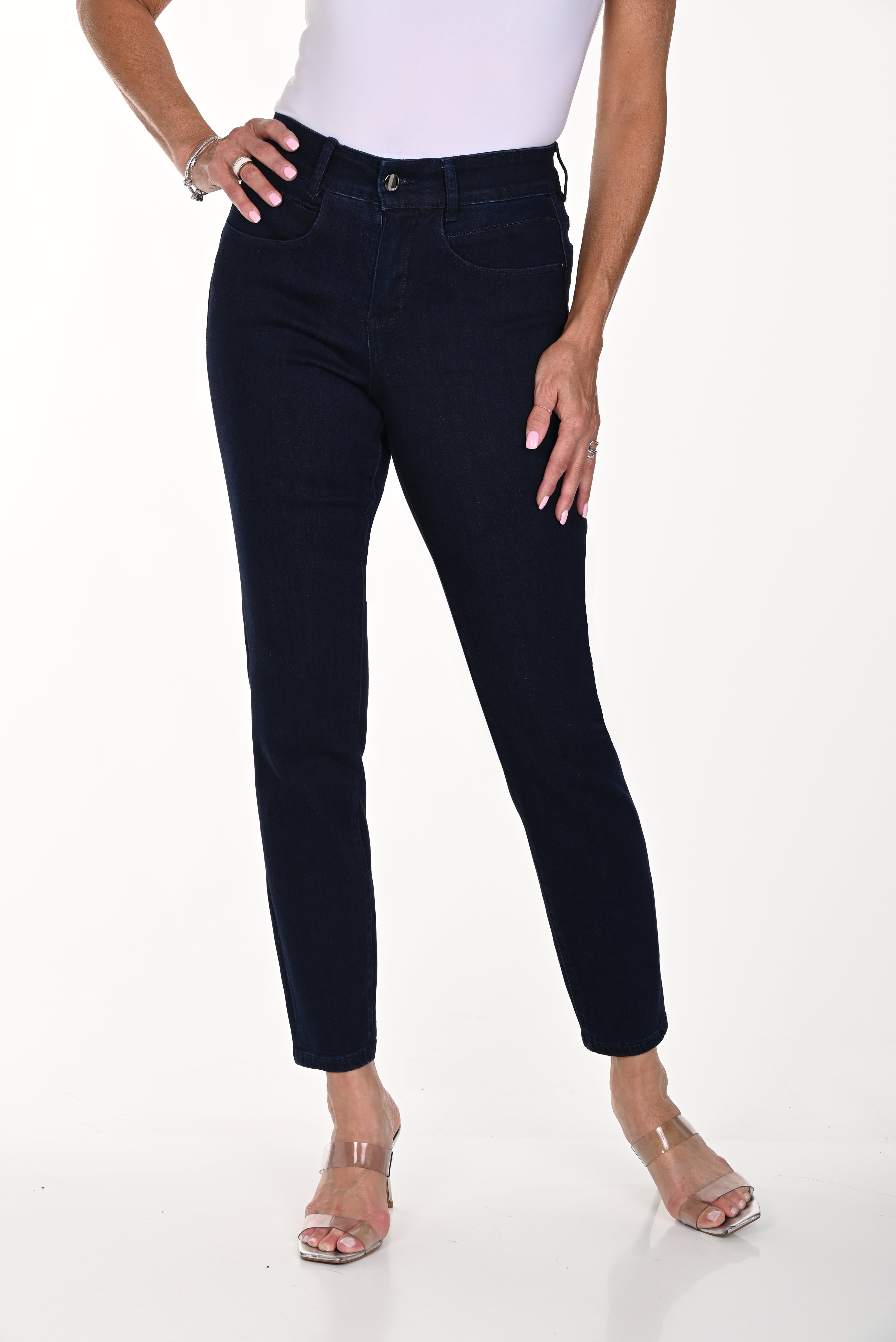 Model showcasing high-rise comfort stretch slim jeans, featuring a polished look for work and comfort for weekends.
