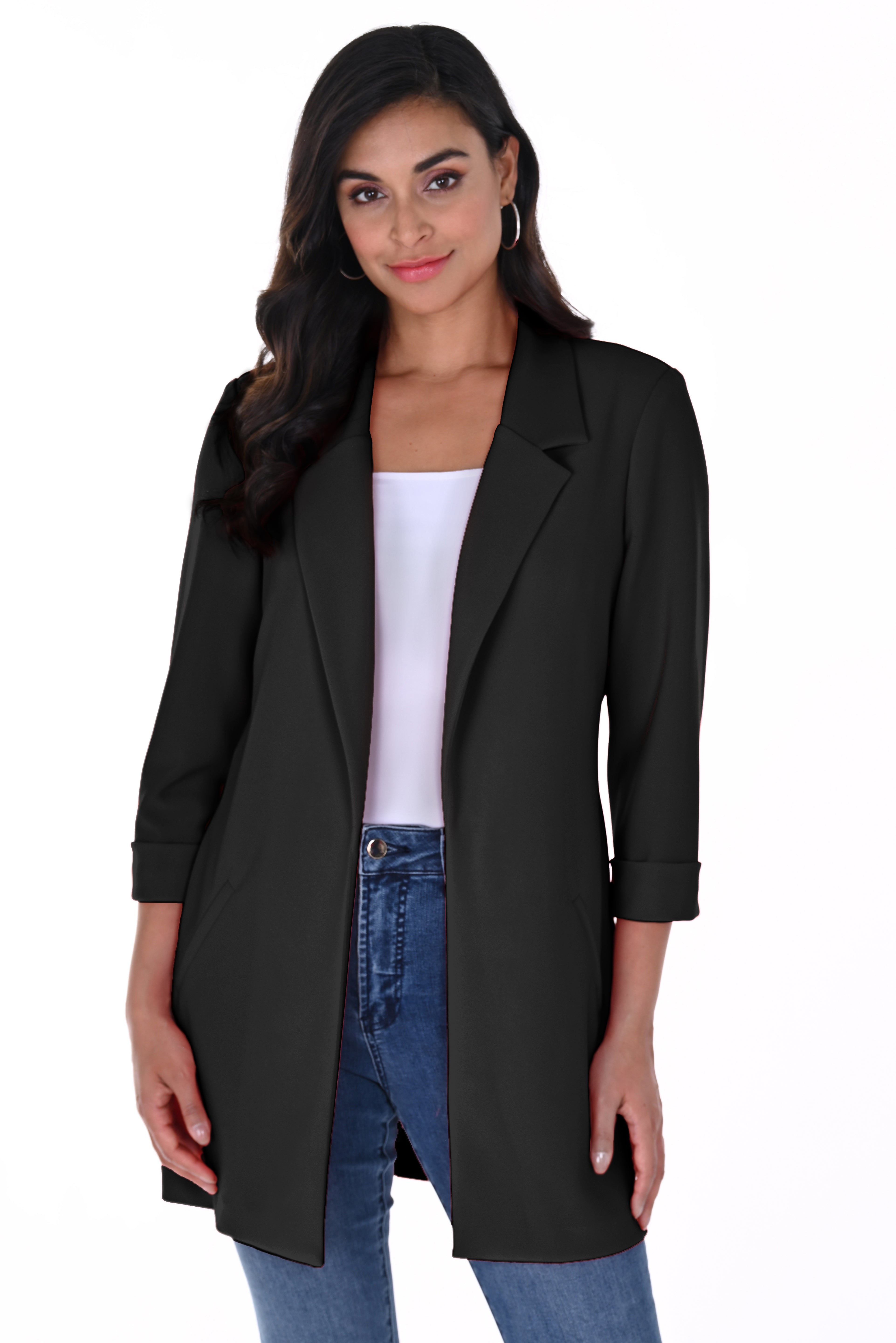 Woman wearing a Black Cleo Longline Blazer with a relaxed open-front design, rolled cuff sleeves, and slim-fit jeans.