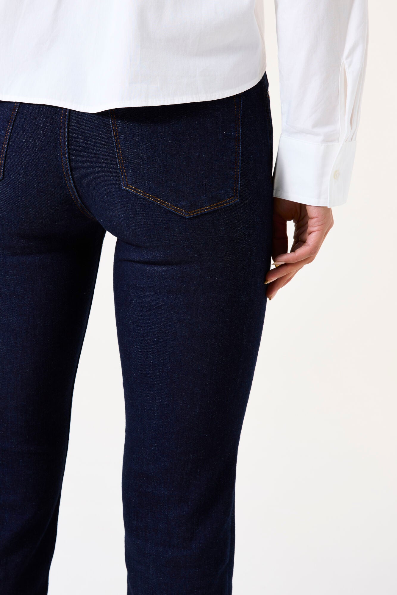 Mid-rise straight-leg denim jeans featuring classic back pockets and a streamlined fit through the leg.