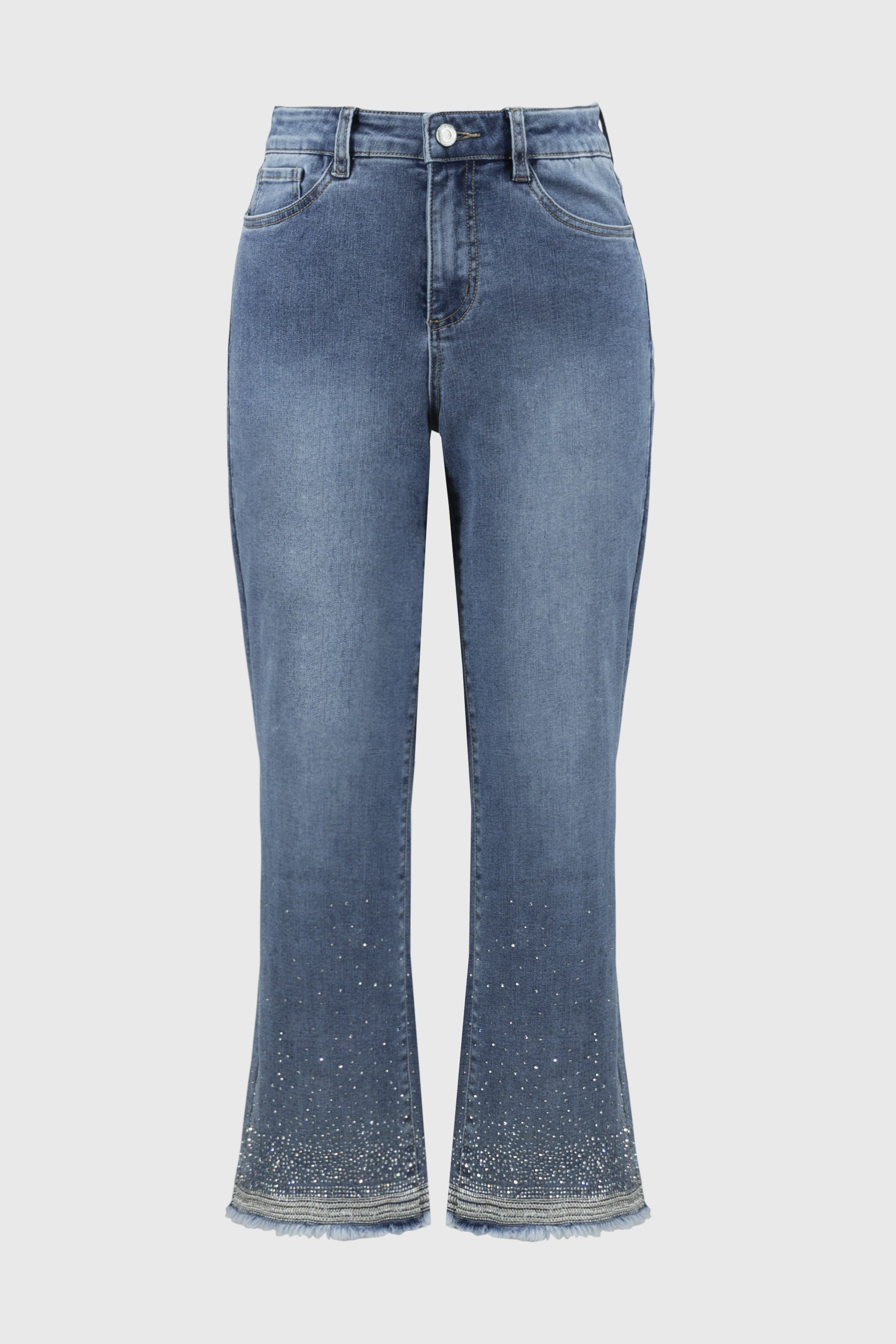 Close-up front view of straight fit crop jeans in medium wash with crystal embellishments and frayed hem.