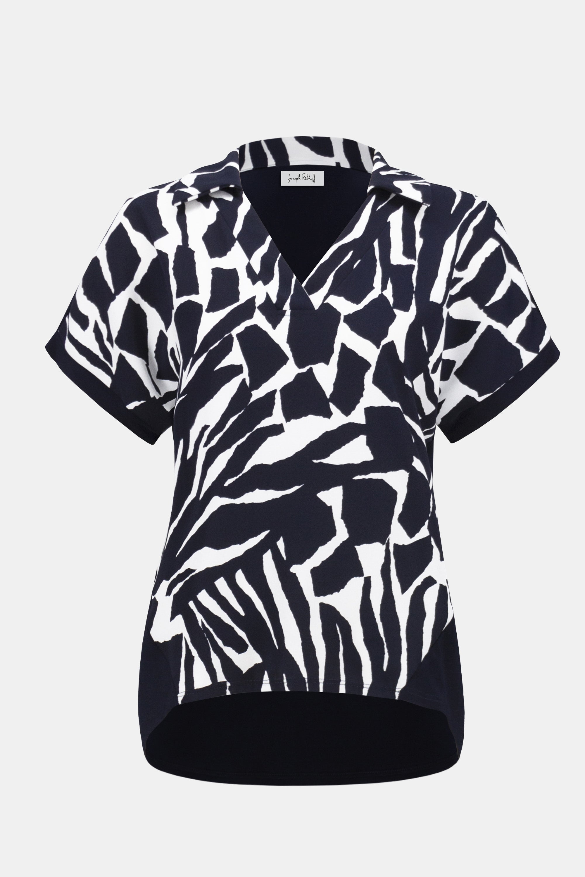 Navy and white abstract animal print short sleeve blouse with a collar and V-neckline.
