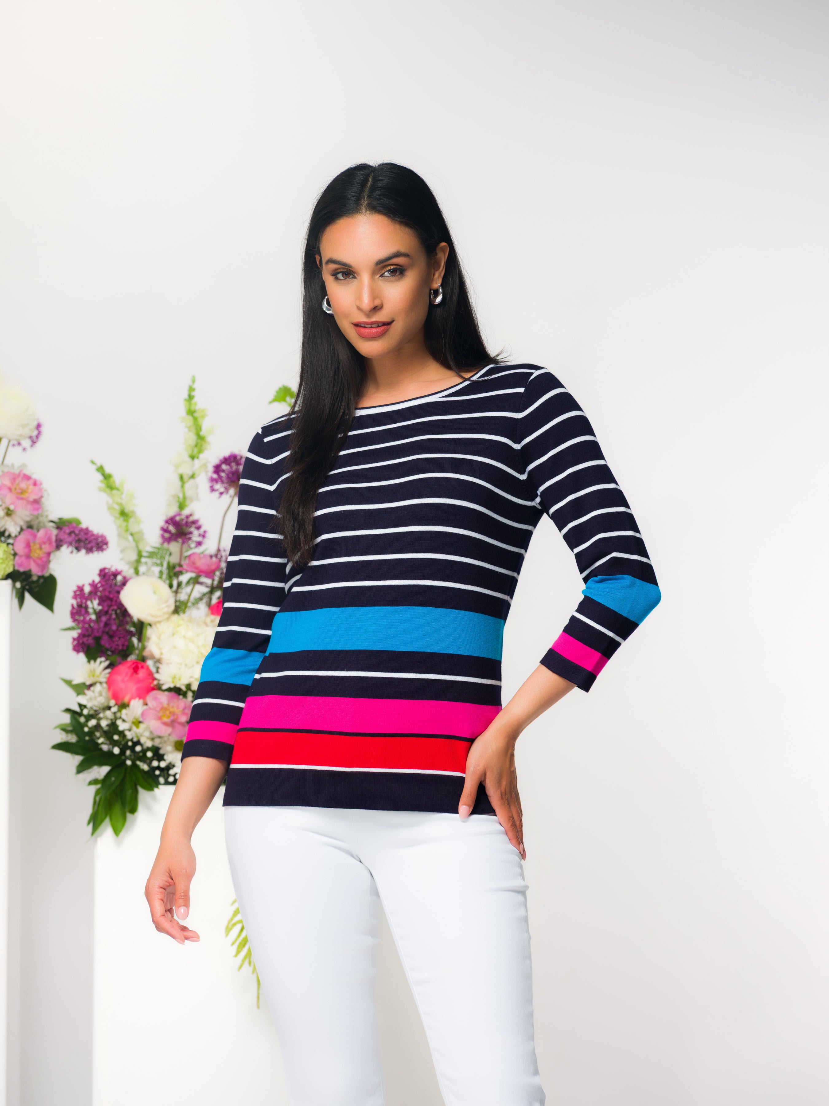 Women’s relaxed-fit striped knit sweater featuring a crew neck, three-quarter length sleeves, and a smooth draped silhouette.