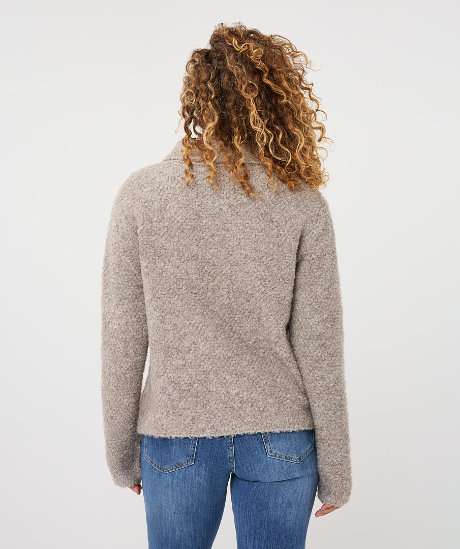 Back view of the Aspen Button Cardigan showing its textured fabric, long sleeves, and gently shaped silhouette.
