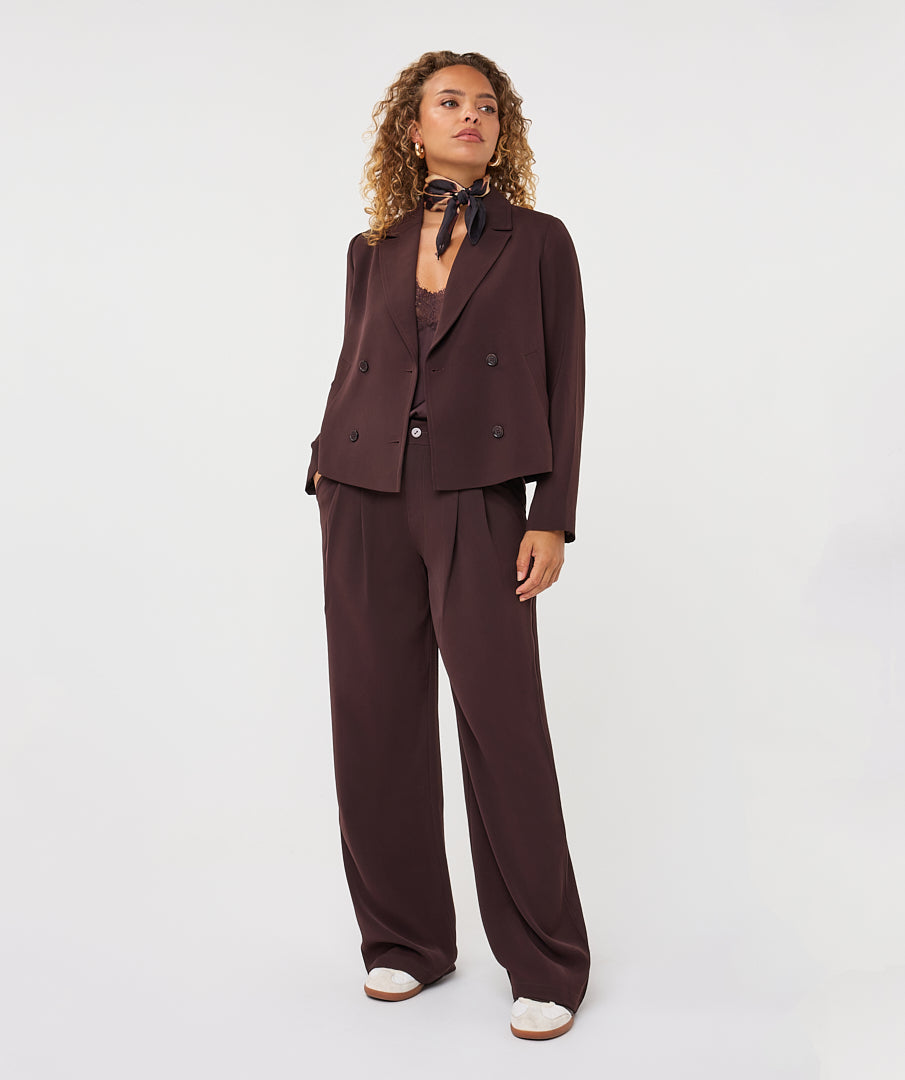 model wearing cacao wide-leg trousers