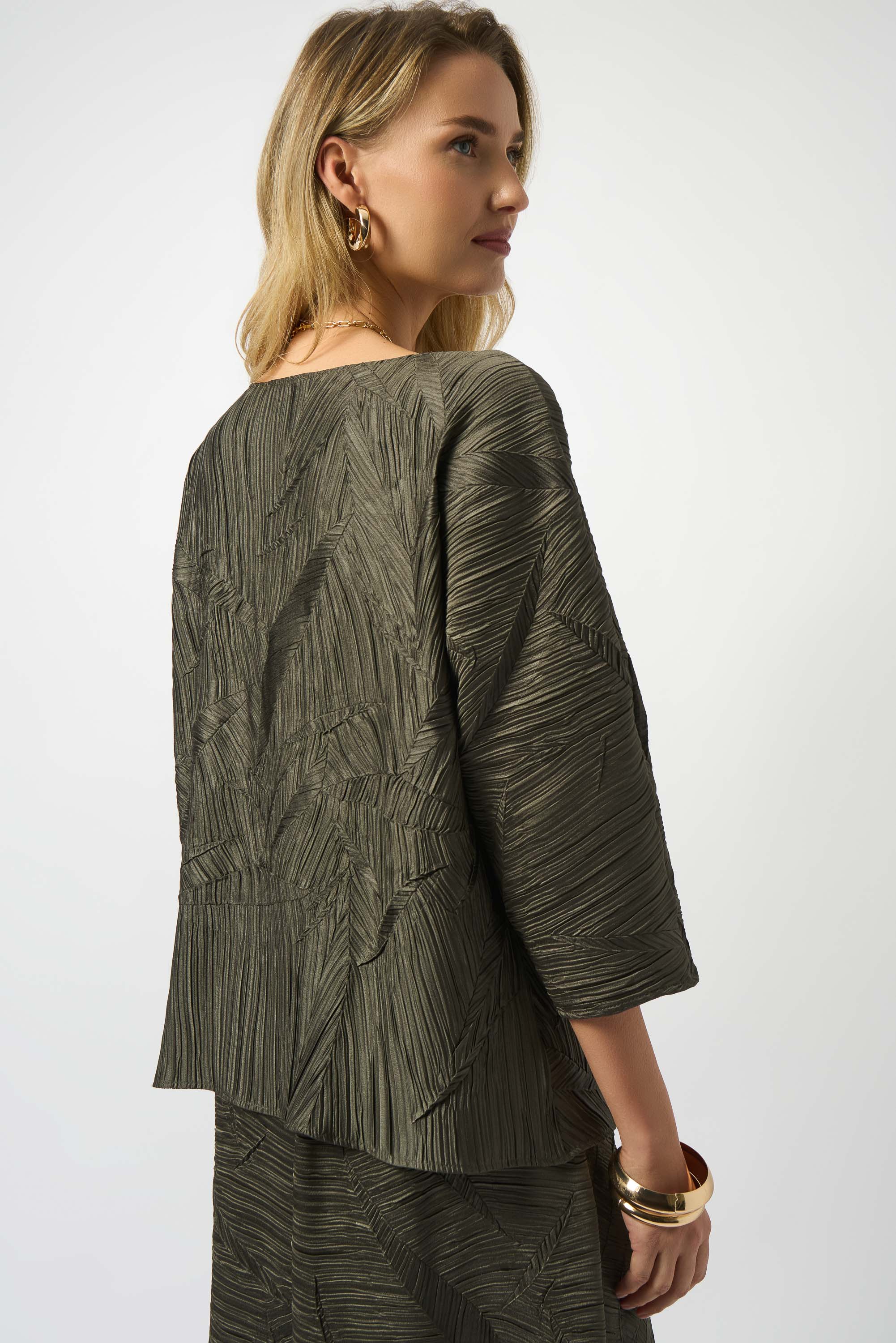 the back of a woman wearing deep-green shirt