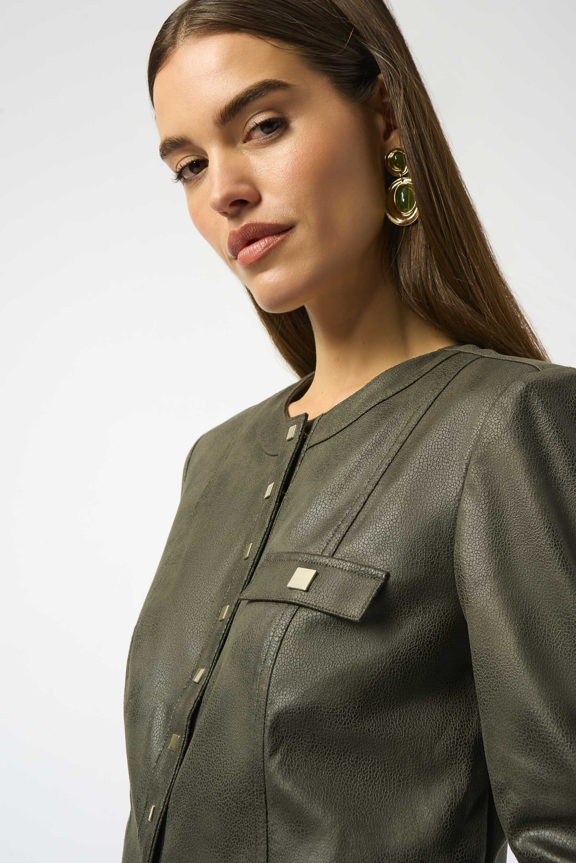 closer-up image of a woman wearing a fashionable jacket with square buttons and flap pocket
