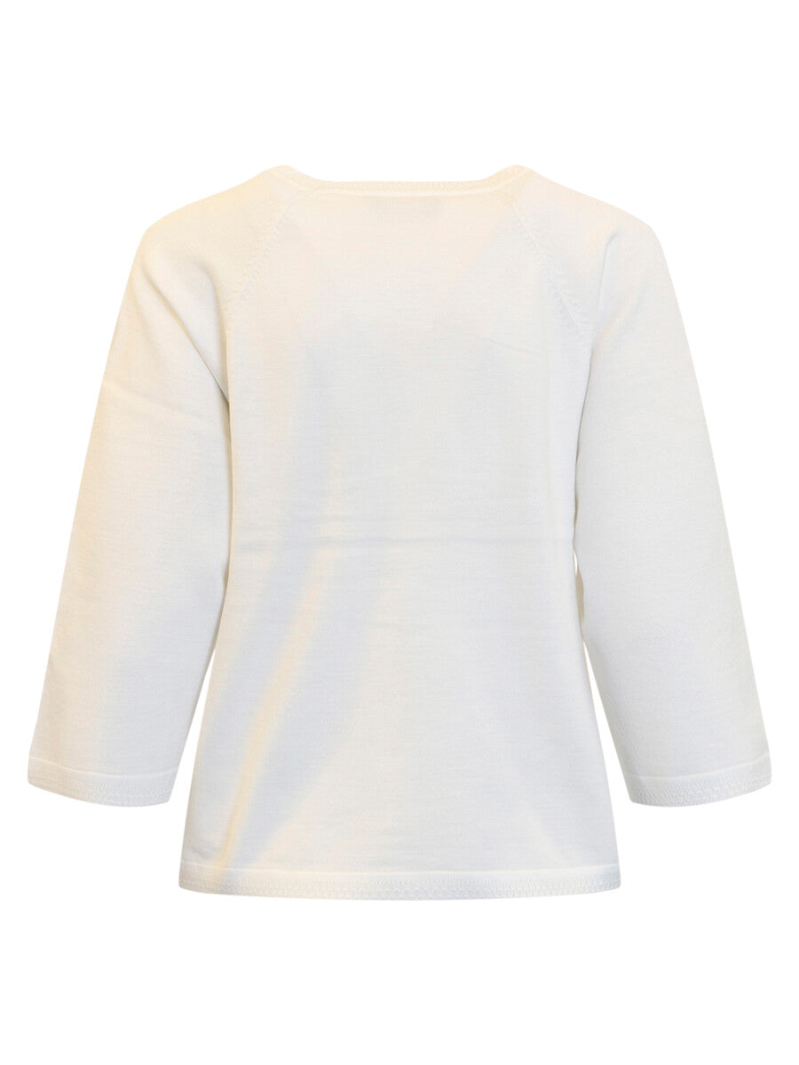 White blouse with a subtle pattern on a white background