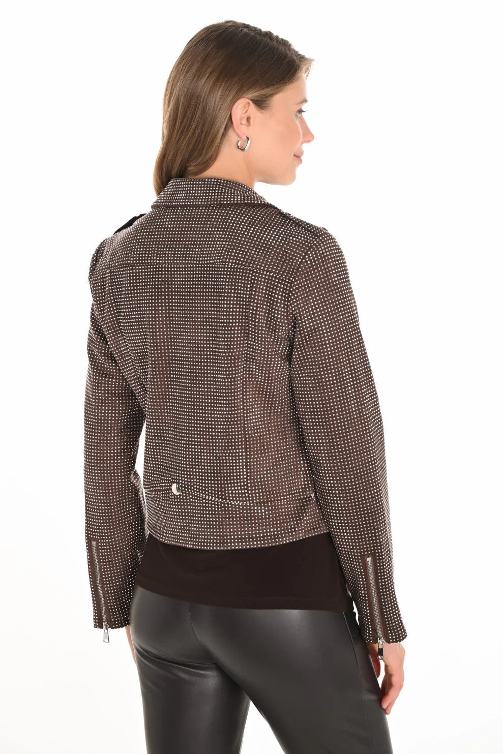 Woman wearing a brown checkered jacket on a white background
