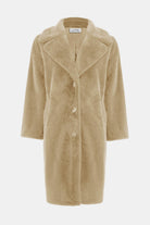 Beige coat with buttons on a white background