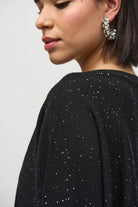 Model showcasing the Sequined Sweater Knit Top with micro-embellishments for a subtle sparkle.