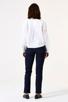 Back view of mid-rise straight-leg denim jeans featuring classic back pockets and a streamlined fit through the leg.