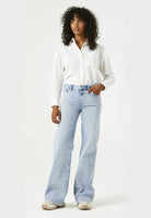 Wide-leg women’s jeans with a relaxed fit, mid-rise waist, and full-length silhouette.