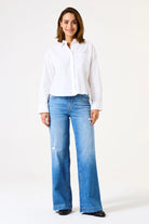 Wide-leg women’s jeans with a relaxed fit, mid-rise waist, and full-length silhouette.
