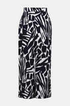  Flat lay of wide-leg pants with bold navy and white abstract print, featuring a clean waistband and flowy silhouette.