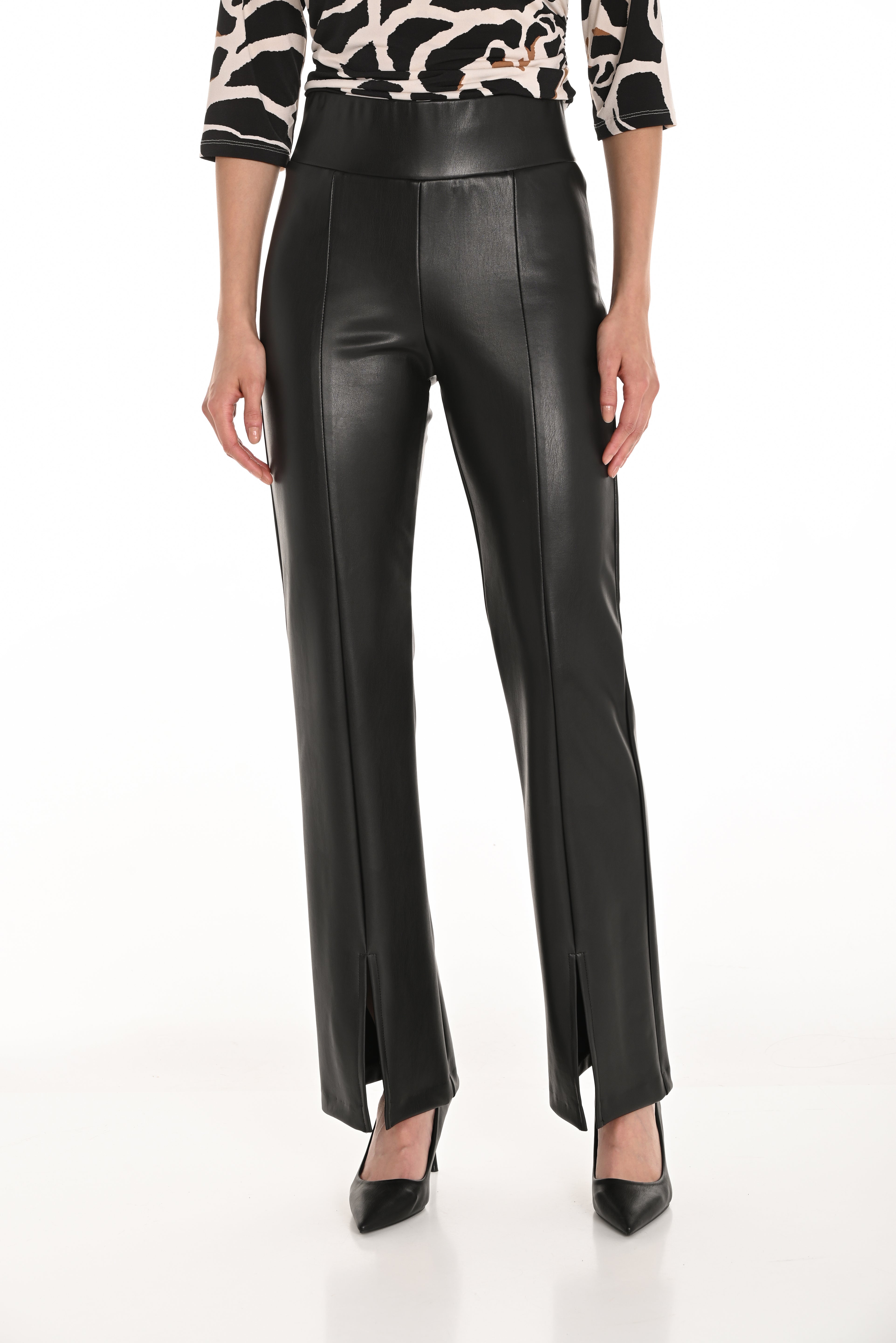 Model showcasing high waisted vegan leather trousers 253134 with sleek design and modern aesthetics.