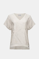 Pleated Satin V-Neck Top featuring elegant pleated satin fabric with geometric pattern and relaxed dolman sleeves.