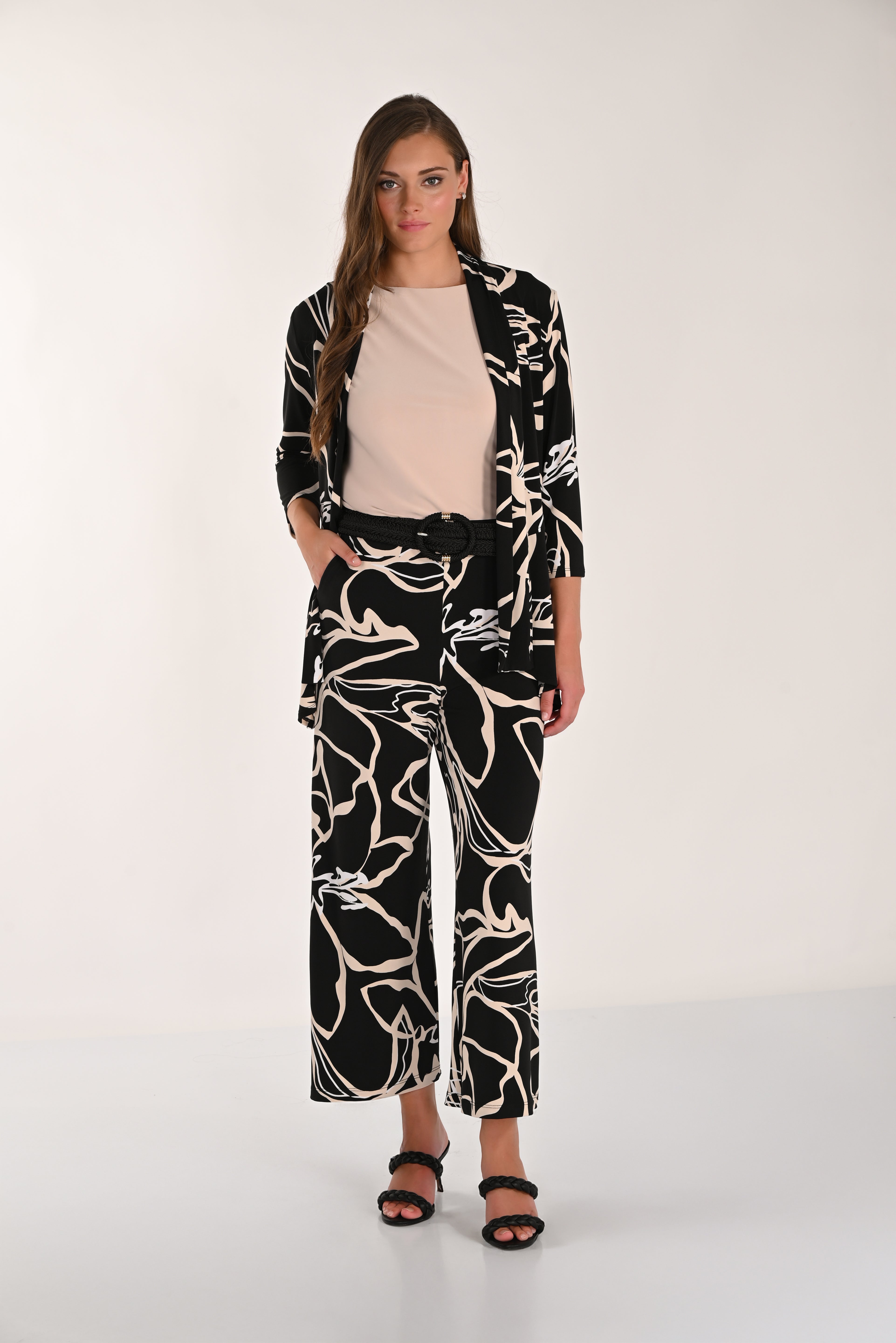 Model wearing the Avenue Wide-Leg Pant styled with a sleeveless top, coordinating printed cover-up, woven belt, and heeled sandals.