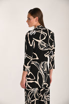 Back view of a women’s abstract print throw-over featuring a relaxed fit, soft stretch knit fabric, and three-quarter sleeves for easy layering and everyday comfort.
