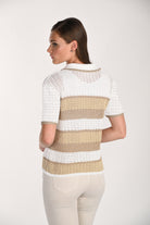 Women's white open-knit short-sleeve polo cardigan with beige and taupe horizontal stripes, shown from the back. Features a lightweight textured knit, ribbed trim, and a relaxed fit paired with cream pants.
