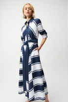 Striped Cotton Fit and Flare Maxi Dress with Reversible Sash displayed on a model, showcasing navy and white stripes.