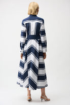 Back view of Striped Cotton Fit and Flare Maxi Dress showcasing navy and white stripes and three-quarter sleeves.