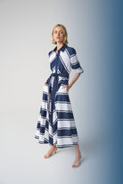 Striped Cotton Fit and Flare Maxi Dress worn by model, showcasing navy and white stripes with a collar and three-quarter sleeves.