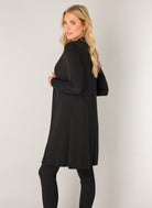Women's black open-front cardigan shown from the back and side angle. The longline silhouette and lightweight fabric create an elegant drape, while the long sleeves and relaxed fit offer versatile everyday styling.