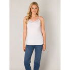 Front view of a lace trim cami with a flattering V-neckline, adjustable spaghetti straps, and a soft, draped silhouette.