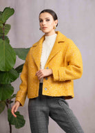 Woman wearing orange jacket and casual pants