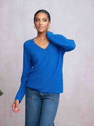 Woman wearing blue sweater and jeans