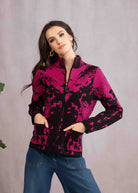 Woman wearing pink and black jacket