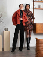 2 Women wearing a dress and jacket