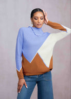 Woman wearing blue abstract sweater
