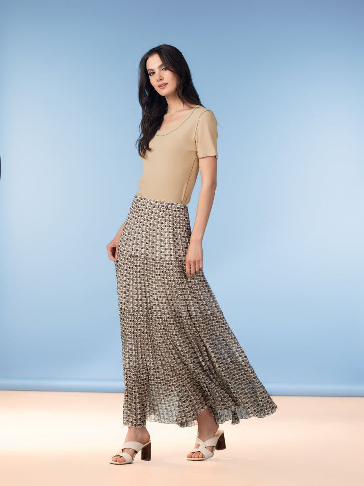 Women’s short-sleeve knit t-shirt worn with a flowing midi skirt, shown in a full-length studio shot highlighting the smooth drape and flattering silhouette.