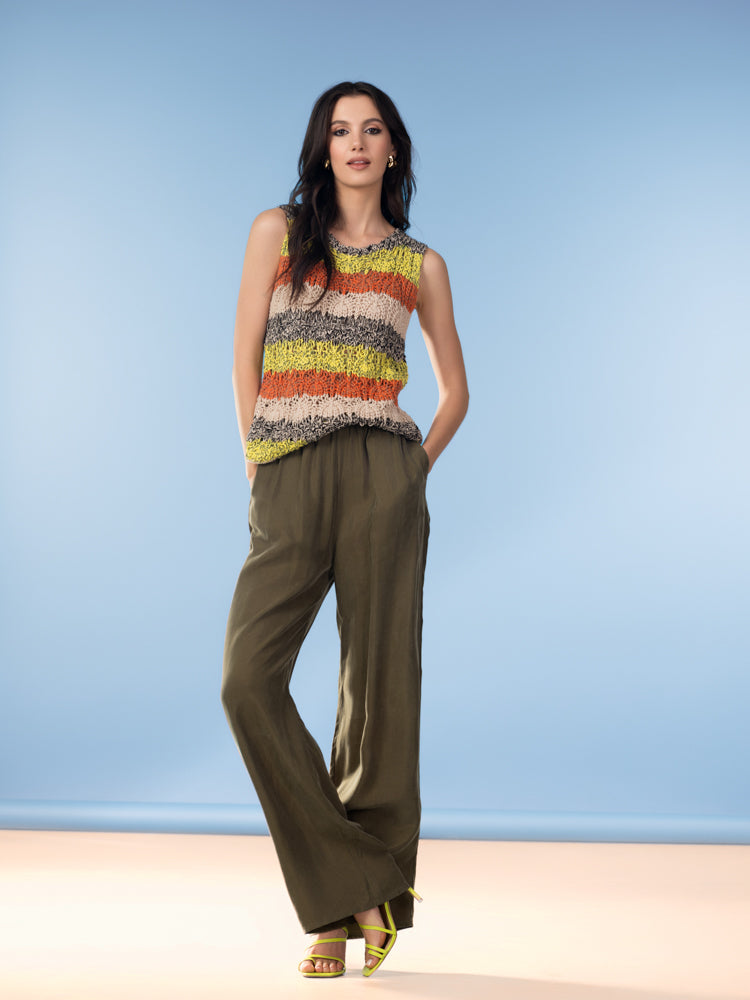 Model wearing a sleeveless textured cotton sweater with a relaxed silhouette, styled for everyday wear