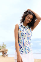 Blue and white paisley sleeveless linen blend blouse with button-front closure and classic shirt collar, lightweight and relaxed fit.