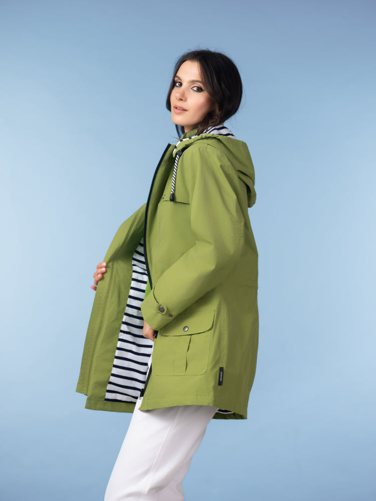 Women’s lightweight green hooded utility jacket with front pockets and adjustable waist, shown side view with striped lining detail.