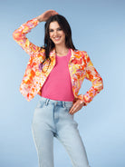 Women’s abstract print linen blend jacket in orange, pink, and yellow with button-front closure and tailored fit.
