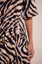 Zebra print dress with a neutral background