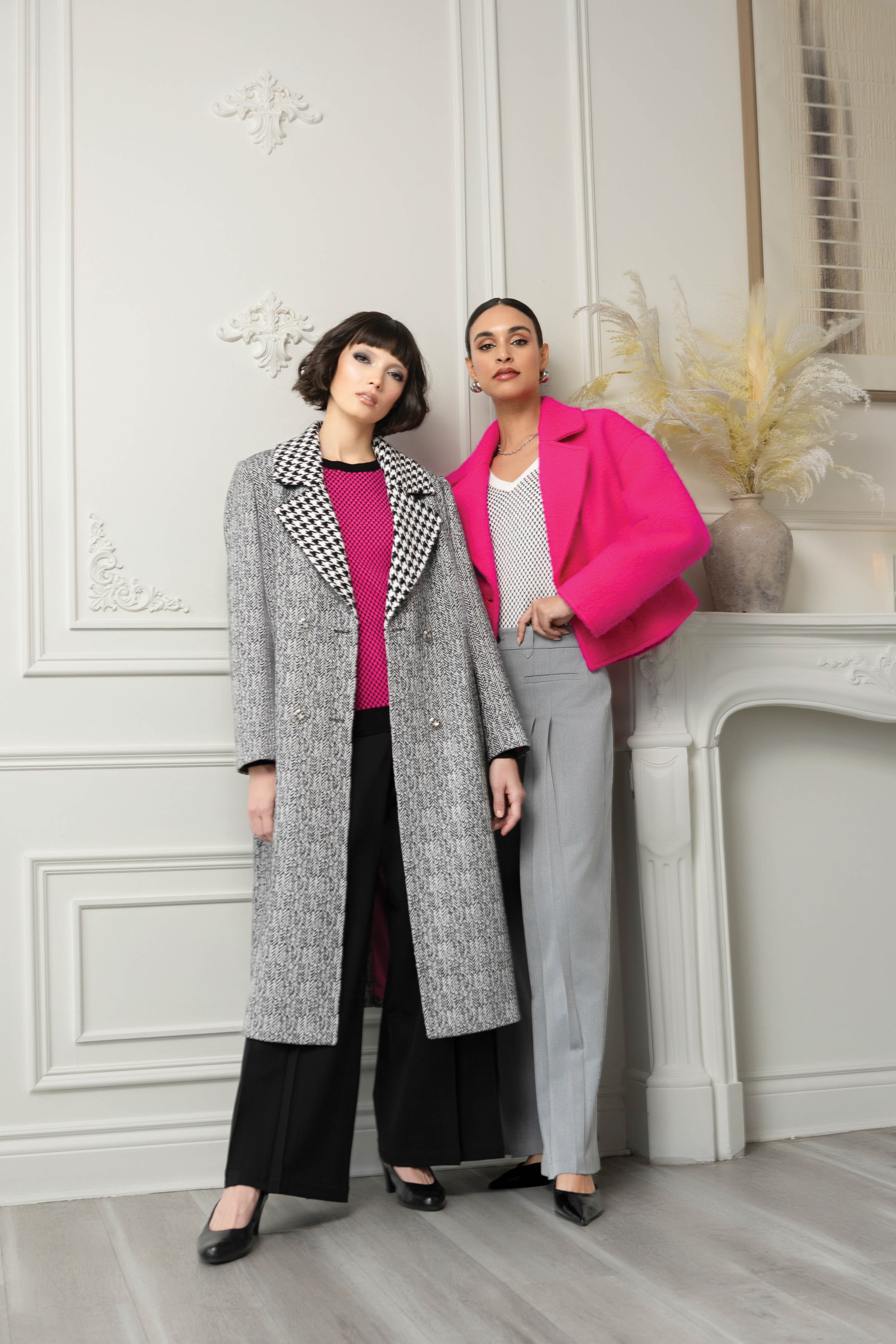 2 women wearing pink tops and pants