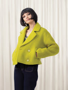 Woman wearing lime jacket