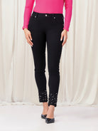 Woman wearing black pants with pink top
