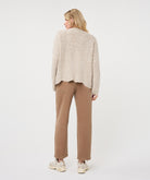 Back view of a woman wearing the Haven Textured Knit Cardigan, showcasing its relaxed fit and textured knit finish.