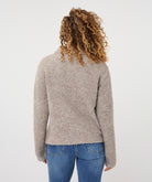 Back view of the Aspen Button Cardigan showing its textured fabric, long sleeves, and gently shaped silhouette.