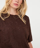Woman wearing the brown Rosalie Lace Top
