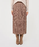 Close-up of the Elara Crinkle Midi Skirt in taupe, highlighting its crinkled texture, elasticated waistband, and flowing midi-length design.