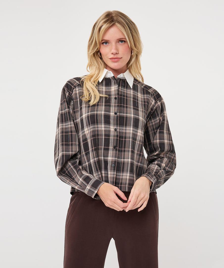 Model wearing a brown and taupe plaid short blouse with a white pointed collar and long sleeves, shown from the front.