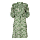 Front view of a green printed tie-waist day dress with button-front detail, three-quarter sleeves, and a soft collar neckline