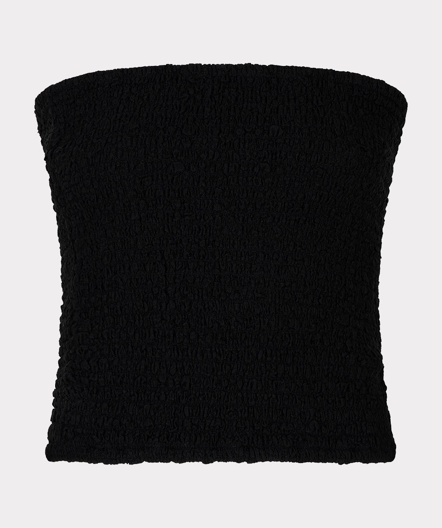 Close-up of black strapless textured tube top with a straight neckline and softly gathered, stretch fabric.